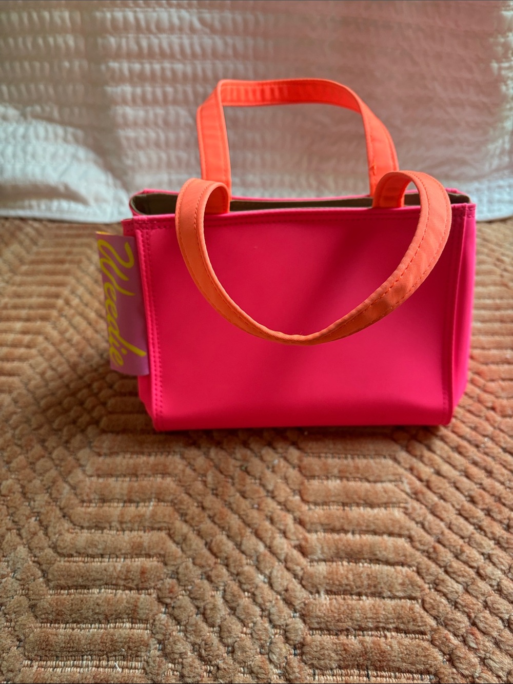 Neon pink Edie Parker weedie bag